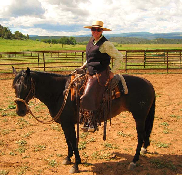 Ingrid Wolff riding a horse in Colorado